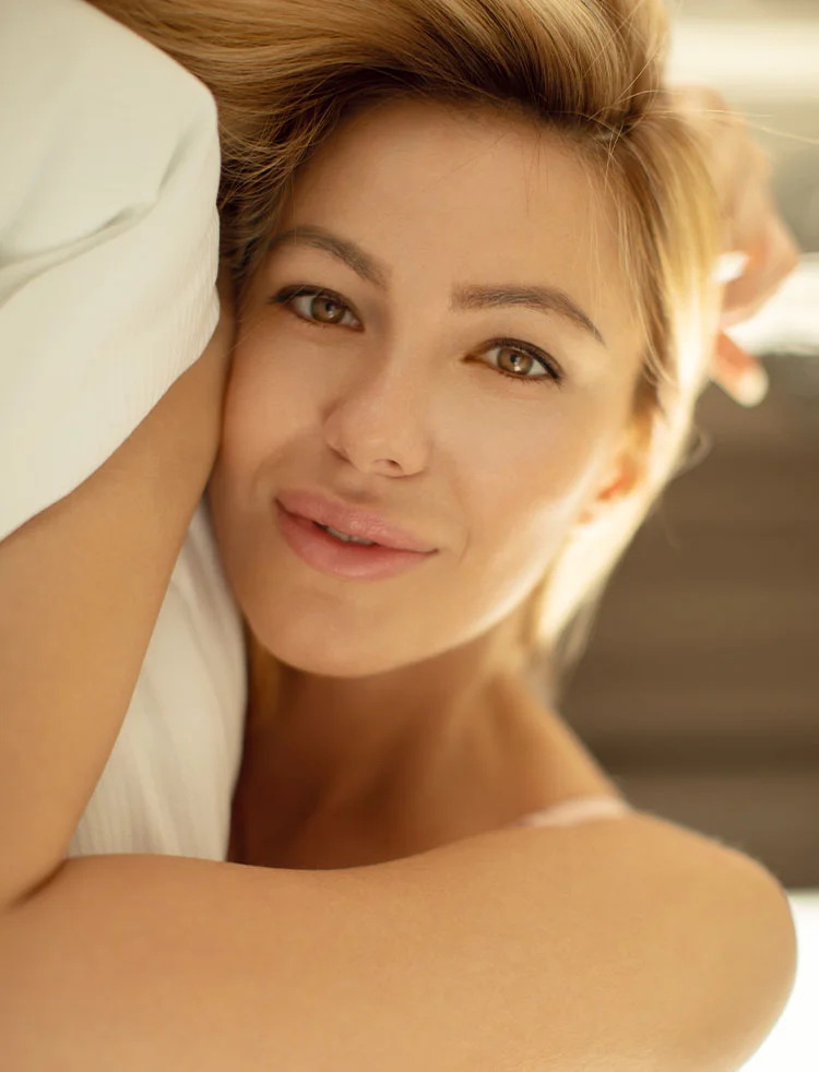 woman in bed post basil cell carcinoma treatment | Geria Dermatology New Jersey