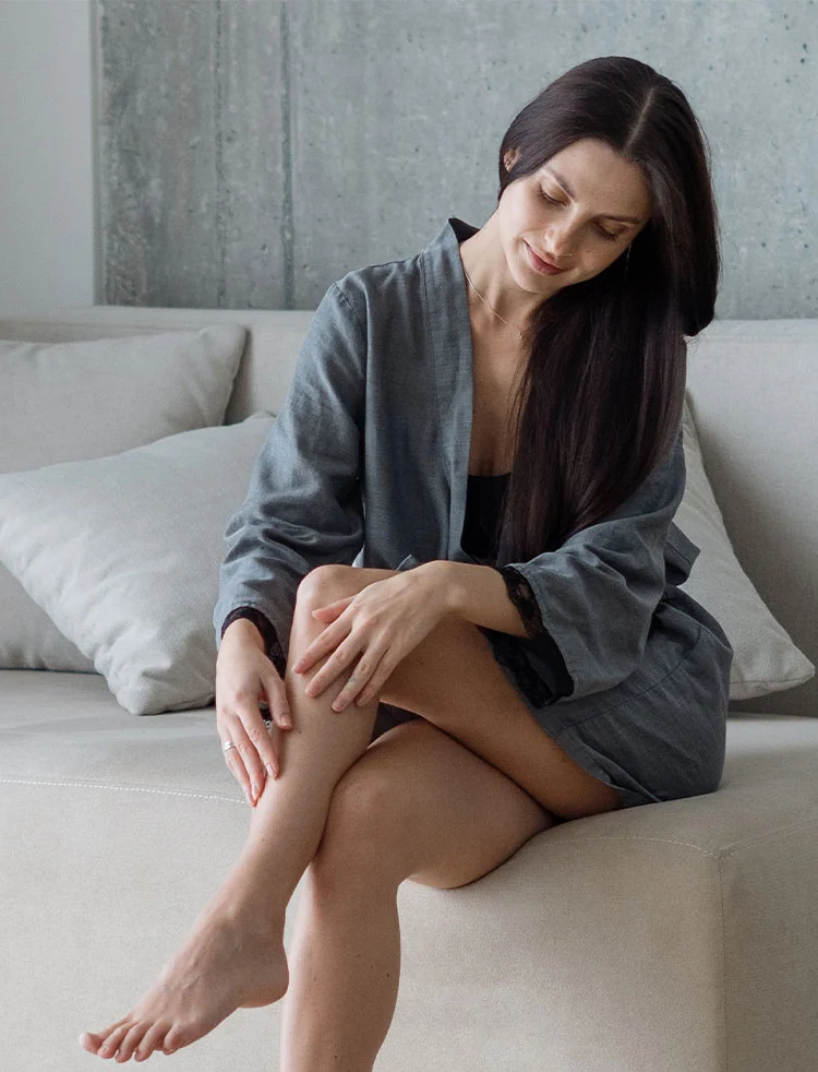 woman rubbing her nice legs | Geria Dermatology New Jersey