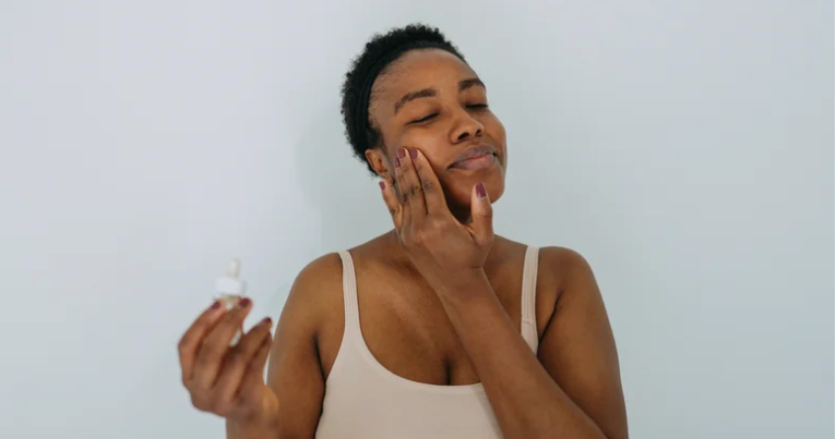 woman rubbing rambutan on her face geria dermatology