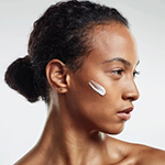 woman with lotion on face