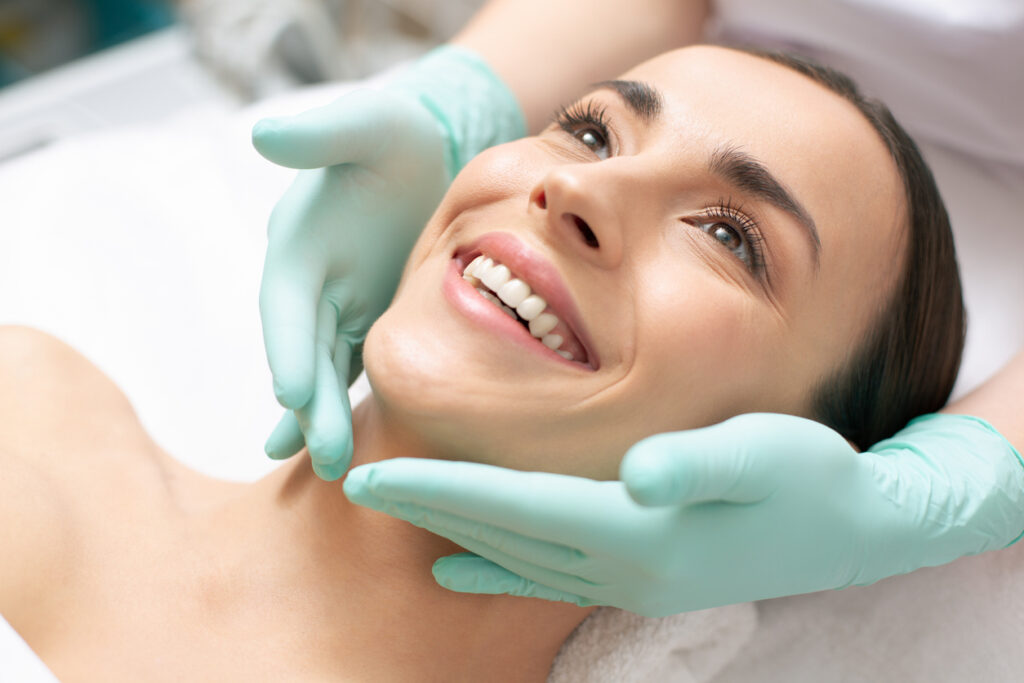 Woman during a facial skin consultation for microneedling and RF microneedling treatment options. Woman during a facial skin consultation for microneedling and RF microneedling treatment options.